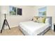 Bright bedroom with a comfortable bed and large window at 10617 N 27Th St, Tampa, FL 33612
