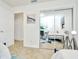 Bedroom with mirrored closet and view of twin beds and workspace at 10617 N 27Th St, Tampa, FL 33612