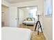 Bedroom with mirrored closet and additional bed visible at 10617 N 27Th St, Tampa, FL 33612
