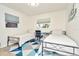 Bedroom with two twin beds, a desk, and a window at 10617 N 27Th St, Tampa, FL 33612