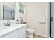 Clean bathroom with a shower, toilet, and white vanity at 10617 N 27Th St, Tampa, FL 33612