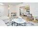 Open living space with foosball table, offering access to kitchen and dining areas at 10617 N 27Th St, Tampa, FL 33612