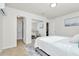 Bedroom with mirrored closet and ensuite bathroom access at 10617 N 27Th St, Tampa, FL 33612
