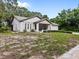 House exterior with front yard at 705 Anclote Dr, Tarpon Springs, FL 34689