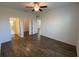 Bright bedroom with wood-look floors and ensuite bathroom at 35166 White Water Lily Way, Zephyrhills, FL 33541