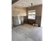 Awaiting transformation, this living room showcases natural light and structural potential for creative remodeling at 704 180Th E Ave, Redington Shores, FL 33708