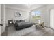 Modern bedroom with neutral tones, a large window, stylish furnishings, and a sleek, comfortable bed at 960 Starkey Rd # 5203, Largo, FL 33771