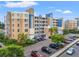 Exterior view of the condo building with attractive landscaping and ample parking for residents and guests at 960 Starkey Rd # 5203, Largo, FL 33771