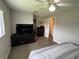 Bedroom with a dresser, closet, and TV stand at 1604 Whitebridge Dr # A, Palm Harbor, FL 34684