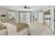 Spacious bedroom with balcony access and connecting door to sitting room with ocean views at 19820 Gulf Blvd # 401, Indian Shores, FL 33785