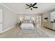 Neutral bedroom with a ceiling fan, a bed with nightstands and lamps, and a dresser at 19820 Gulf Blvd # 401, Indian Shores, FL 33785