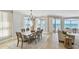 Elegant dining room features a large table, comfortable seating, and beach views perfect for entertaining guests at 19820 Gulf Blvd # 401, Indian Shores, FL 33785