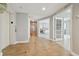 Wide hallway with decorative tile, elevator access, and view to bedroom and sitting room at 19820 Gulf Blvd # 401, Indian Shores, FL 33785