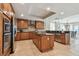 Bright kitchen with modern appliances, a center island and granite countertops at 19820 Gulf Blvd # 401, Indian Shores, FL 33785