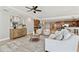 Open-concept living room featuring modern decor, wood accents, comfortable seating, and ample natural light at 19820 Gulf Blvd # 401, Indian Shores, FL 33785