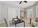 Bright office with a desk and chair, white closet, and view to another room at 19820 Gulf Blvd # 401, Indian Shores, FL 33785