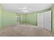 Bright bedroom with a ceiling fan and neutral carpet at 5095 Bay Ne St # 114, St Petersburg, FL 33703