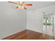 Cozy dining area with hardwood floors and a ceiling fan near a kitchen view at 5095 Bay Ne St # 114, St Petersburg, FL 33703