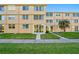 Condo exterior with grassy area and sidewalk at 5095 Bay Ne St # 114, St Petersburg, FL 33703