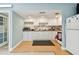 Bright and functional kitchen with white cabinets and appliances, ideal for cooking and meal preparation at 5095 Bay Ne St # 114, St Petersburg, FL 33703
