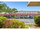View of covered parking area with mature landscaping and trees in a sunny environment at 5095 Bay Ne St # 114, St Petersburg, FL 33703