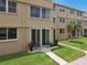 Condo patio with small table and chairs overlooking grassy area at 5095 Bay Ne St # 114, St Petersburg, FL 33703