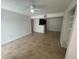 Open living room with a view of the kitchen and built-in shelving at 455 Alt 19 S # 21, Palm Harbor, FL 34683