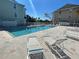 Enjoy the sun and take a dip in this community pool with lounge chairs at 455 Alt 19 S # 21, Palm Harbor, FL 34683