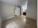 Spacious bedroom with tile floors and en-suite bathroom at 455 Alt 19 S # 21, Palm Harbor, FL 34683