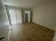 Bright bedroom with tile flooring and sliding door at 455 Alt 19 S # 21, Palm Harbor, FL 34683