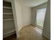 Cozy bedroom with built-in shelving and large window at 455 Alt 19 S # 21, Palm Harbor, FL 34683