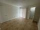 Bright bedroom with tile flooring and sliding door at 455 Alt 19 S # 21, Palm Harbor, FL 34683