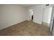 Bedroom with tile floors and access to bathroom at 455 Alt 19 S # 21, Palm Harbor, FL 34683