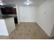 Eat-in kitchen with dark wood cabinets and granite countertops at 455 Alt 19 S # 21, Palm Harbor, FL 34683