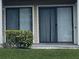 Private patio with sliding glass doors, perfect for relaxing outdoors at 455 Alt 19 S # 21, Palm Harbor, FL 34683