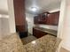 Kitchen with granite countertops and wood cabinets at 455 Alt 19 S # 21, Palm Harbor, FL 34683