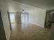 Bright living room with tile floors and sliding glass doors leading to a patio at 455 Alt 19 S # 21, Palm Harbor, FL 34683