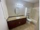 Bathroom with granite vanity and an oval mirror at 455 Alt 19 S # 21, Palm Harbor, FL 34683