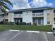 Two-story building with balconies and parking at 455 Alt 19 S # 21, Palm Harbor, FL 34683
