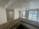 Kitchen with granite countertops and view of living room at 455 Alt 19 S # 21, Palm Harbor, FL 34683