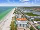 Aerial view showcasing beachfront location and nearby amenities at 19820 Gulf Blvd # 401, Indian Shores, FL 33785