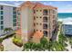 Oceanfront building, featuring terracotta tile roofs and balconies at 19820 Gulf Blvd # 401, Indian Shores, FL 33785