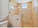 Large walk-in shower with tiled walls and a built-in seat at 19820 Gulf Blvd # 401, Indian Shores, FL 33785