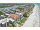 Aerial view of beachfront community, highlighting building and beach at 19820 Gulf Blvd # 401, Indian Shores, FL 33785