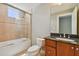 Bathroom with granite countertop, large tiled shower, and bathtub at 19820 Gulf Blvd # 401, Indian Shores, FL 33785