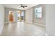 Spacious bedroom with tile floors, ceiling fan, and access to bathroom and balcony at 19820 Gulf Blvd # 401, Indian Shores, FL 33785