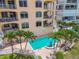 Complex boasts a refreshing pool and lush landscaping at 19820 Gulf Blvd # 401, Indian Shores, FL 33785