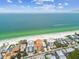 Aerial view of beachfront building and surrounding area at 19820 Gulf Blvd # 401, Indian Shores, FL 33785