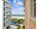 Aerial view of the building, pool, and ocean at 19820 Gulf Blvd # 401, Indian Shores, FL 33785