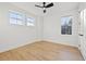 Bright bedroom with hardwood floors, a ceiling fan and plenty of natural light from multiple windows at 135 48Th Ave, St Petersburg, FL 33703